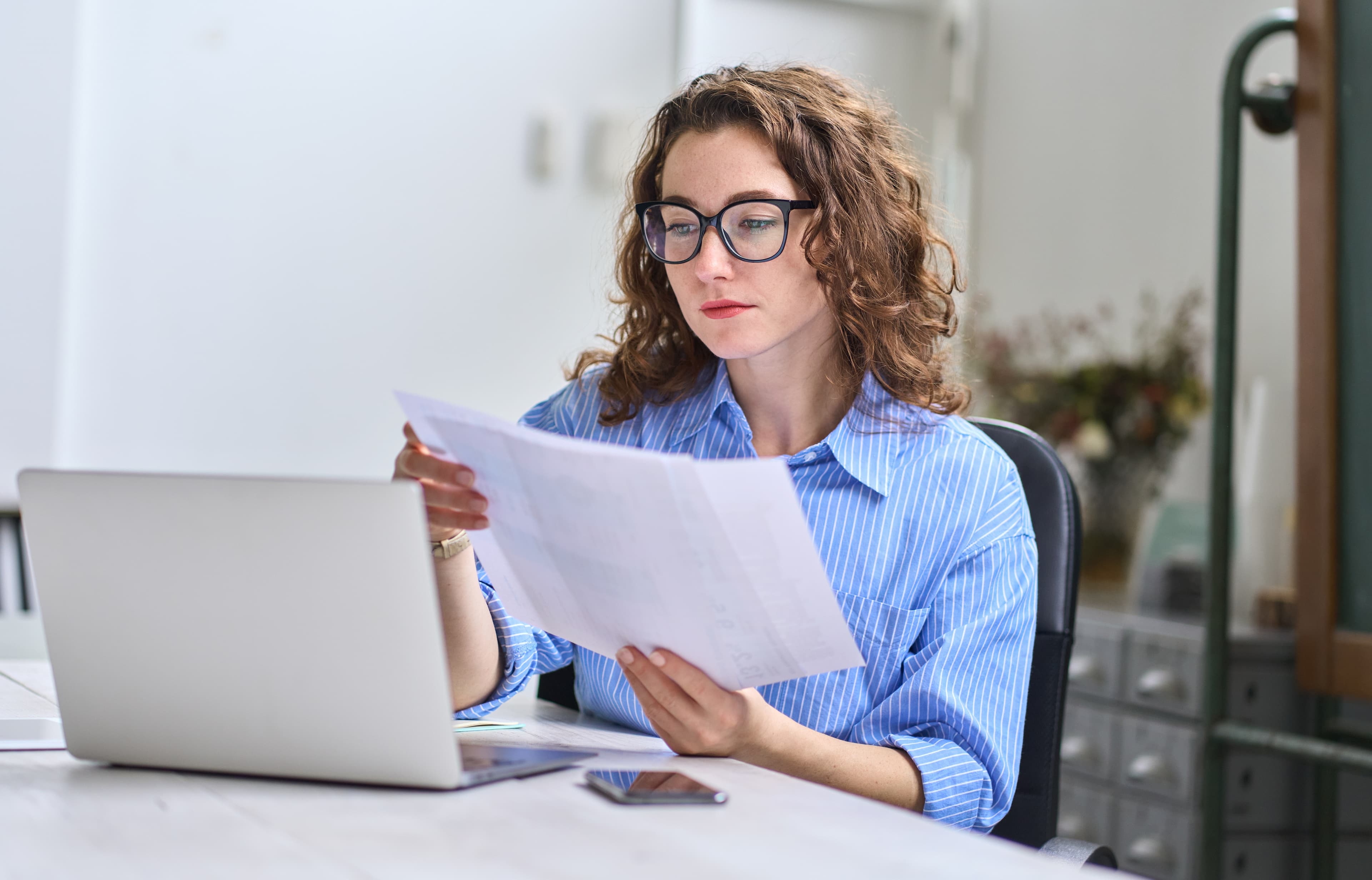 Professional auditor conducting internal audit review