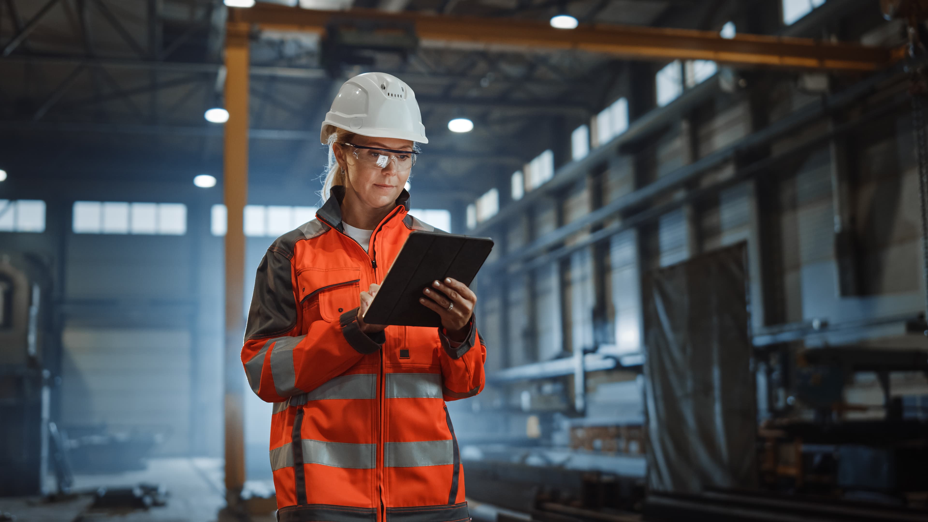 Safety inspector with clipboard conducting workplace compliance evaluation